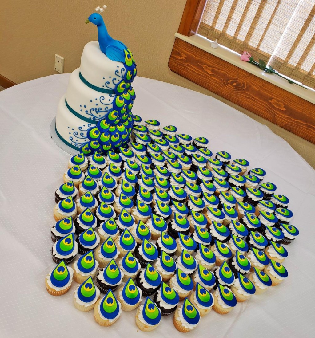 Picture of: This Incredible Peacock Wedding Cake Uses Cupcakes For The Tail