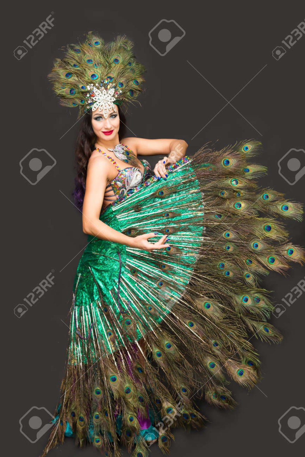 Picture of: Woman In Peacock Feather Carnival Costume Dancing In Show